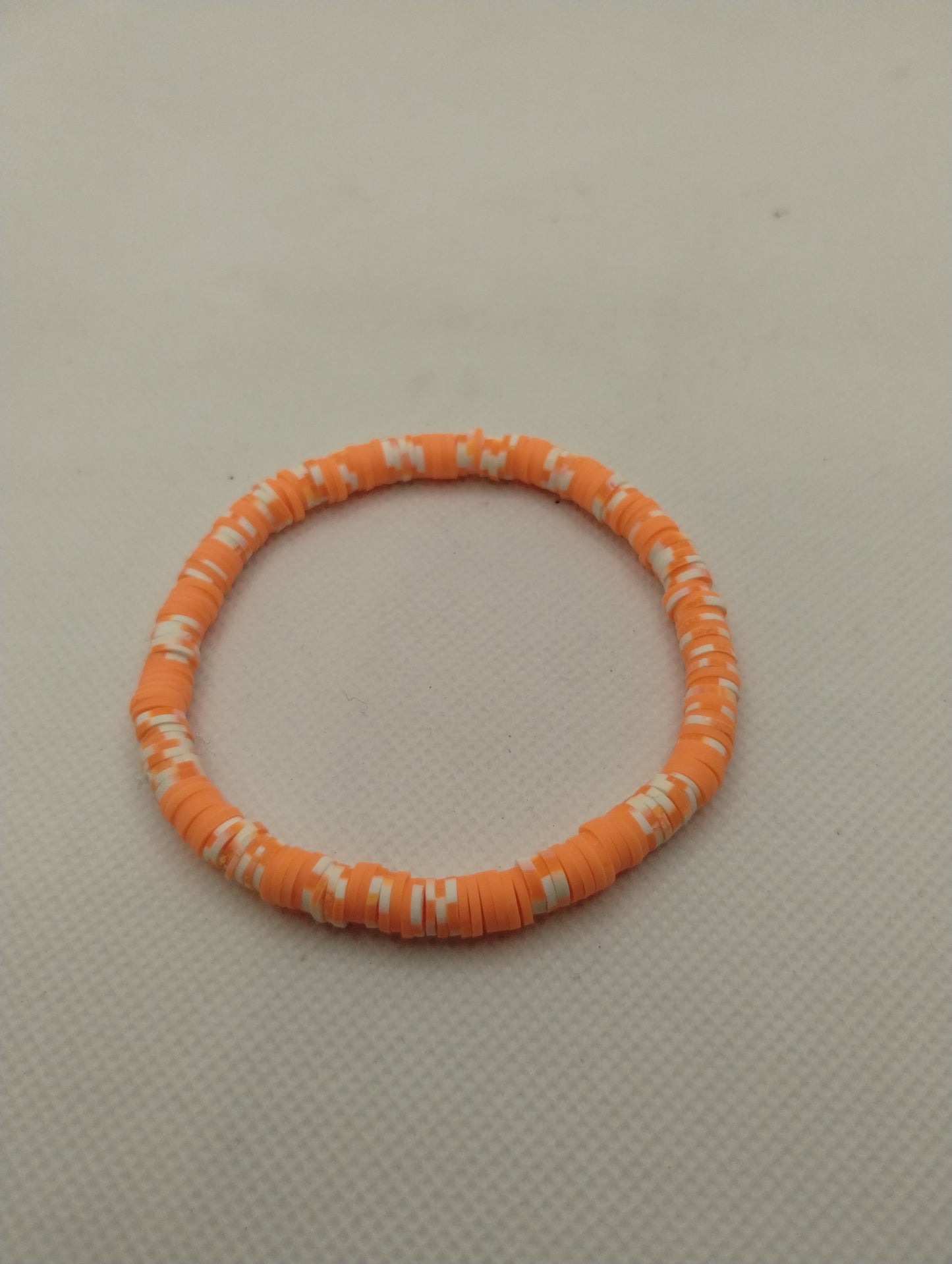 ORANGE AND WHITE BRACELET