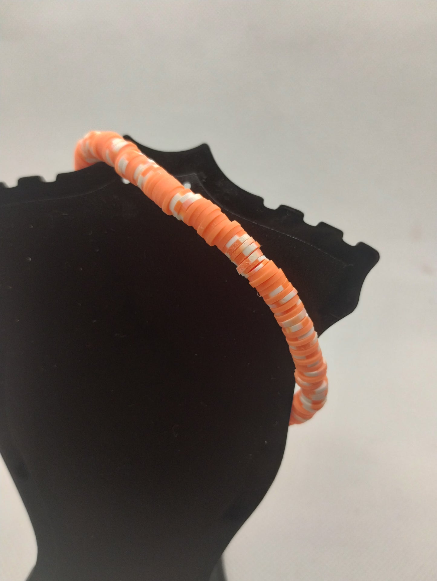 ORANGE AND WHITE BRACELET